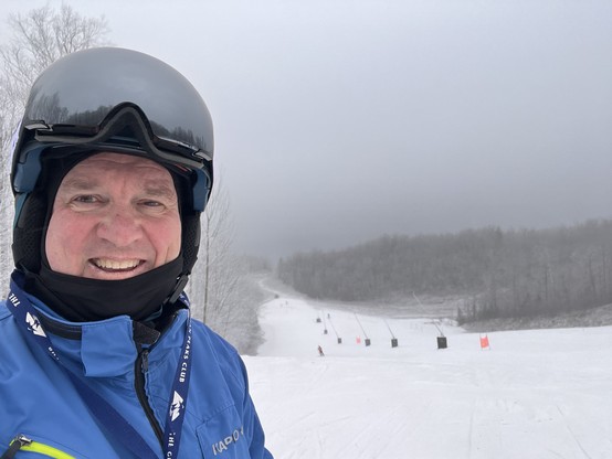 futurist jim carroll on a ski hill 