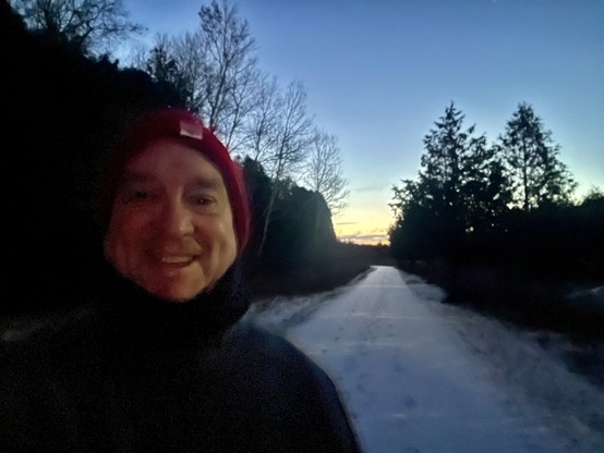 Future is Jim Carroll in a beautiful morning sunrise scene with snow with a big goofy grin on his face