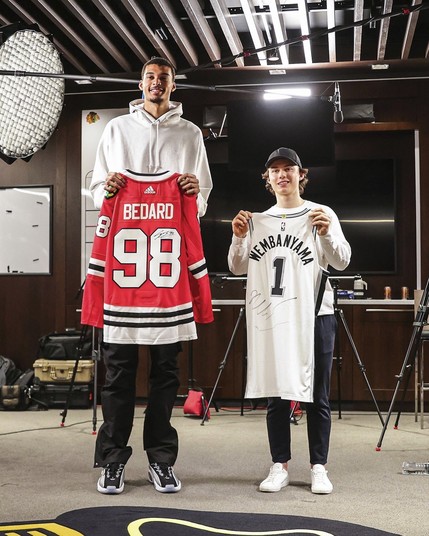 An image of basketball player Wembanyama holding a Conner Bedard hockey shirt, and Conner Bedard holding a Wembanyama basketball jersey.