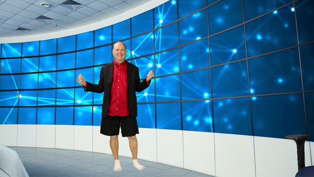 Futurist Jim Carroll in his virtual studio. He's got a business jacket on top, shorts on the bottom.