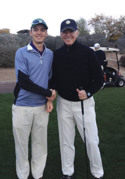 Futurist Jim Carroll's young son Thomas with President Joe Biden on a golf course.