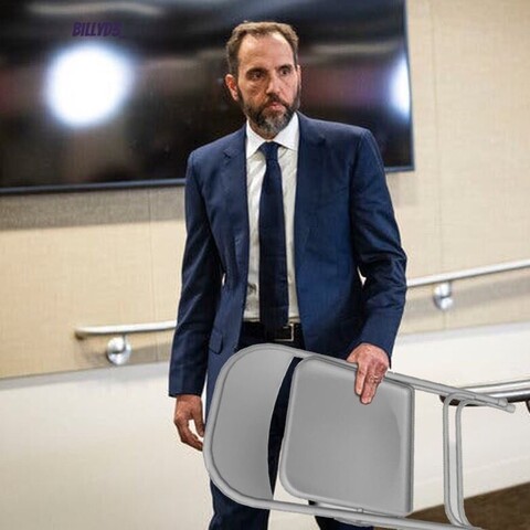 Jack Smith holding a folding chair.