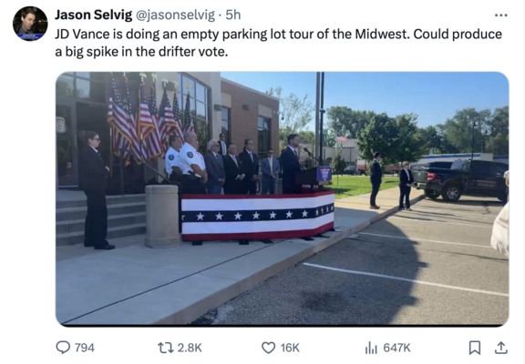 JD Vance speaking in an empty parking lot.