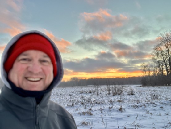 Is Jim Carroll with a big goofy sunrise smile on his face